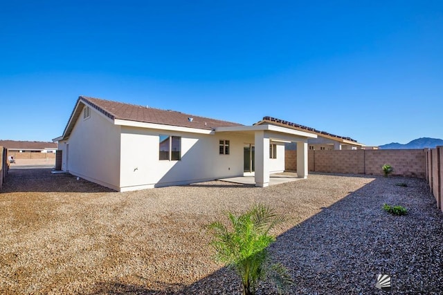 12546 E 51st Pl, Yuma, AZ 85367 - rear view of property featuring a fenced backyard, a patio area, and stucco siding