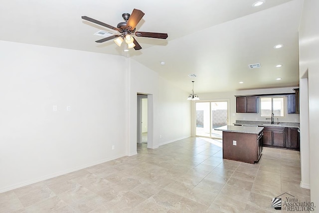 12546 E 51st Pl, Yuma, AZ 85367 - kitchen featuring visible vents, a center island, dark brown cabinets, a sink, and open floor plan
