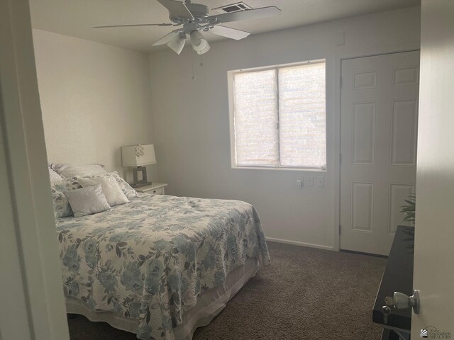 carpeted bedroom with baseboards, ceiling fan, and visible vents