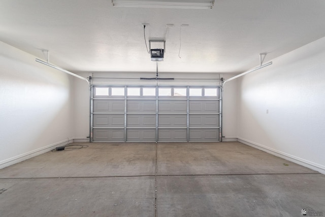 3481 W 27th Ln, Yuma, AZ 85364 - garage featuring baseboards and a garage door opener