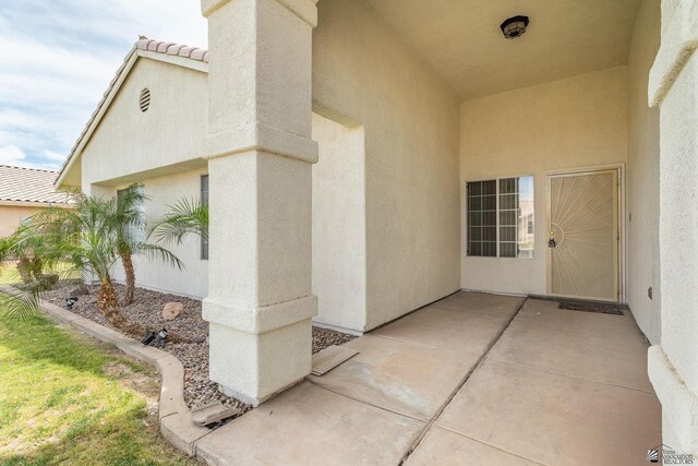 3481 W 27th Ln, Yuma, AZ 85364 - entrance to property featuring stucco siding, a patio, and a tiled roof