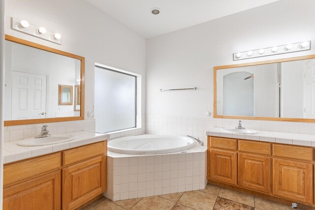 3481 W 27th Ln, Yuma, AZ 85364 - bathroom featuring two vanities, a bath, and tile patterned floors
