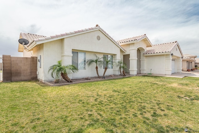 3481 W 27th Ln, Yuma, AZ 85364 - mediterranean / spanish-style house with a tile roof, stucco siding, and an attached garage