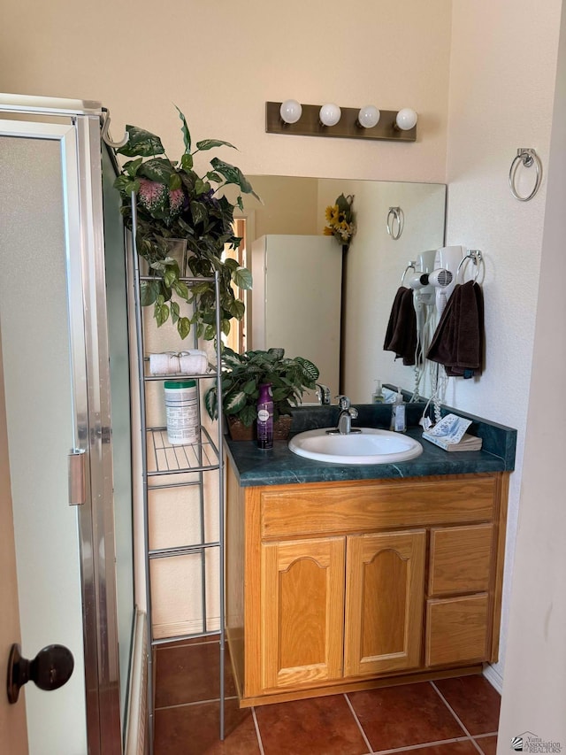 14453 E 55th St, Yuma, AZ 85367 - full bathroom with vanity, tile patterned floors, and a shower with door