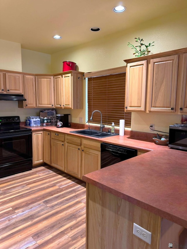 14453 E 55th St, Yuma, AZ 85367 - kitchen with a sink, under cabinet range hood, black appliances, and light brown cabinets