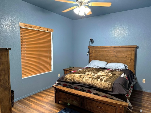 14453 E 55th St, Yuma, AZ 85367 - bedroom with baseboards, ceiling fan, and wood finished floors