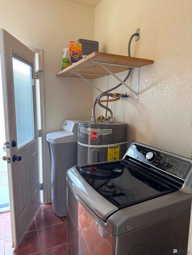 14453 E 55th St, Yuma, AZ 85367 - laundry room featuring laundry area, washer / clothes dryer, strapped water heater, dark tile patterned flooring, and a textured wall