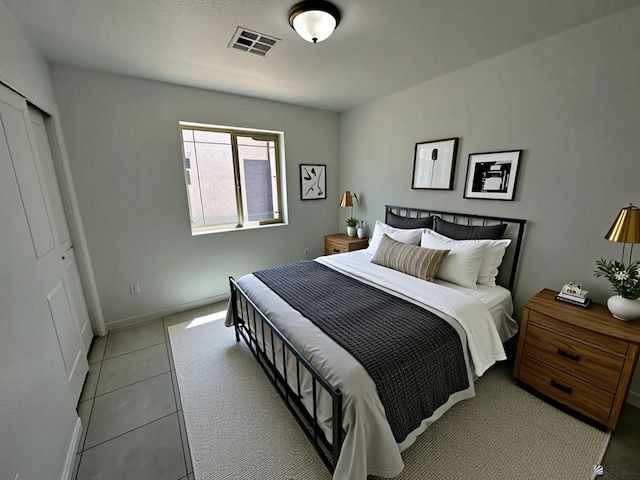10744 E 45th Pl, Yuma, AZ 85367 - bedroom with a closet, light tile patterned floors, and baseboards