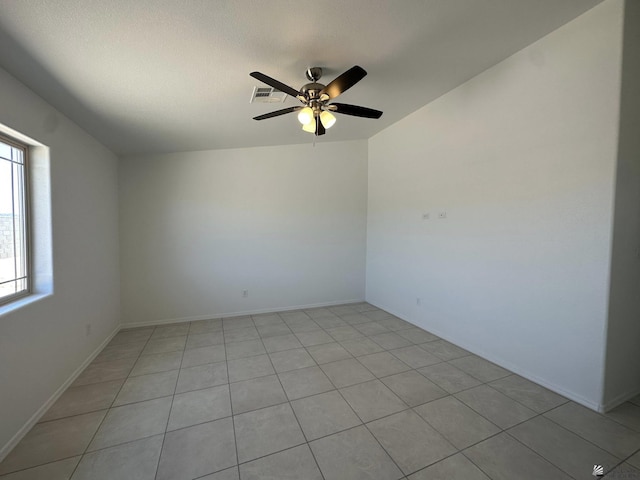 10744 E 45th Pl, Yuma, AZ 85367 - spare room featuring a ceiling fan, light tile patterned flooring, and baseboards