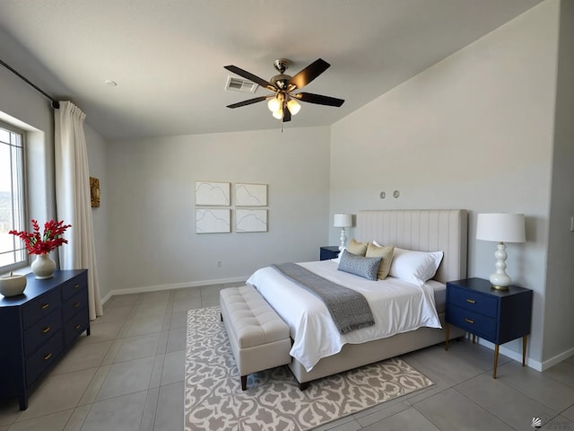 10744 E 45th Pl, Yuma, AZ 85367 - bedroom with light tile patterned floors, baseboards, vaulted ceiling, and ceiling fan