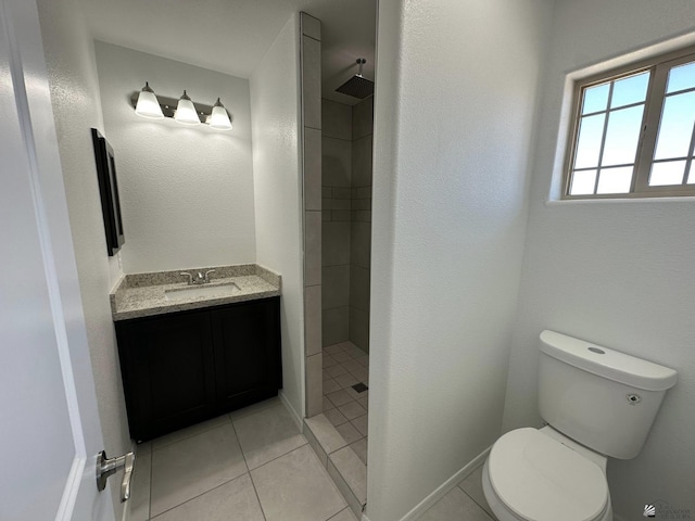 10744 E 45th Pl, Yuma, AZ 85367 - full bathroom featuring toilet, a tile shower, vanity, and tile patterned floors