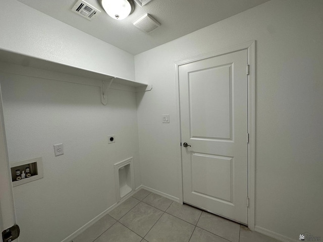 10744 E 45th Pl, Yuma, AZ 85367 - laundry area with washer hookup, electric dryer hookup, light tile patterned flooring, and baseboards