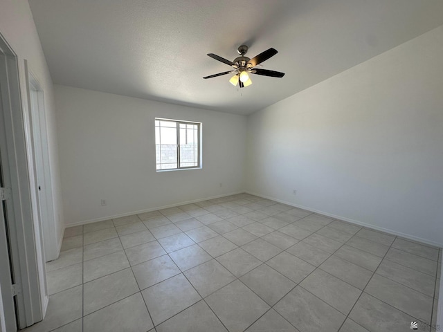 10744 E 45th Pl, Yuma, AZ 85367 - unfurnished room with a ceiling fan, light tile patterned floors, and baseboards