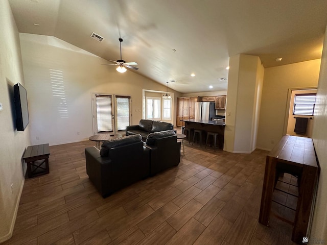 living room with vaulted ceiling and ceiling fan