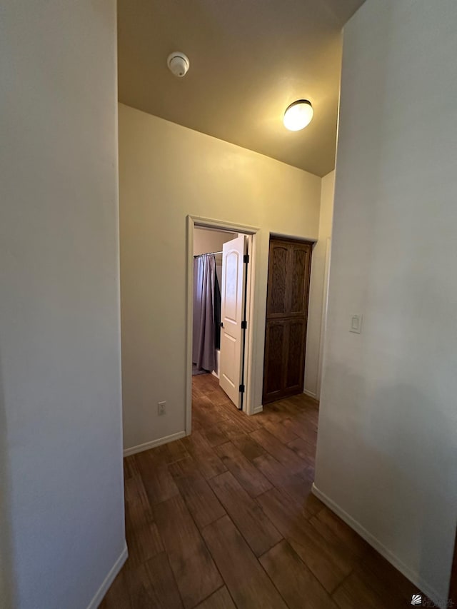 hall featuring dark wood-type flooring