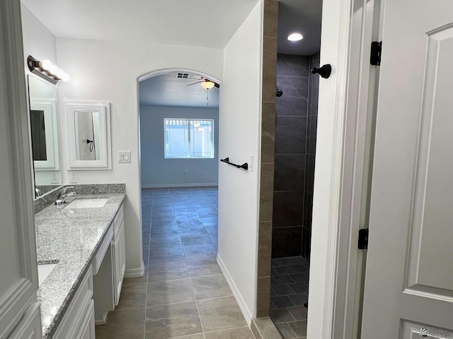 29861 E Vista Ridge Blvd, Wellton, AZ 85356 - full bathroom featuring double vanity, a ceiling fan, a walk in shower, tile patterned floors, and a sink