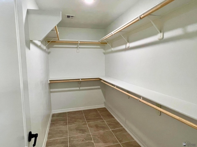 29861 E Vista Ridge Blvd, Wellton, AZ 85356 - walk in closet with dark tile patterned floors and visible vents