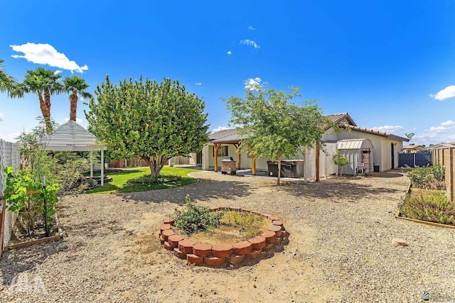 11637 E 27th St, Yuma, AZ 85367 - rear view of property with a tile roof, a gazebo, a fenced backyard, and stucco siding
