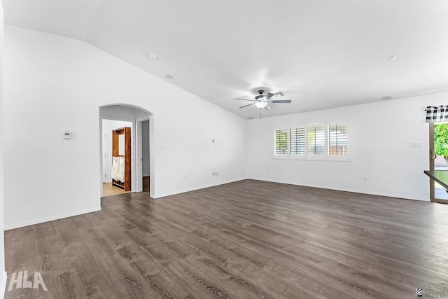 11637 E 27th St, Yuma, AZ 85367 - unfurnished living room featuring arched walkways, a ceiling fan, dark wood-style flooring, and a wealth of natural light