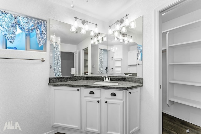 11637 E 27th St, Yuma, AZ 85367 - bathroom featuring a closet, vanity, a shower with curtain, and wood finished floors