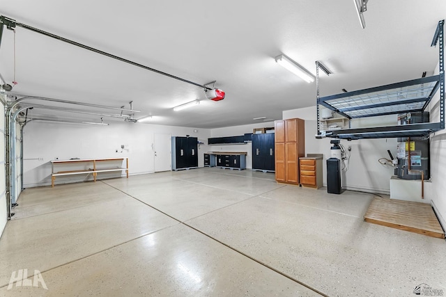 11637 E 27th St, Yuma, AZ 85367 - garage featuring baseboards and a garage door opener