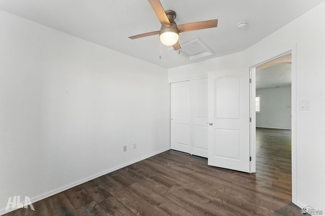 11637 E 27th St, Yuma, AZ 85367 - unfurnished bedroom featuring a ceiling fan, attic access, baseboards, a closet, and dark wood-type flooring