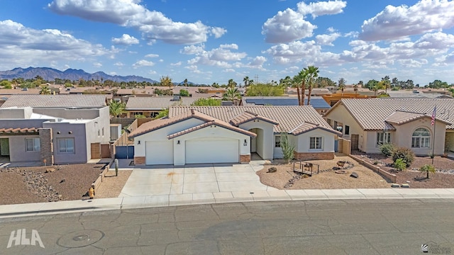 11637 E 27th St, Yuma, AZ 85367 - view of front of home featuring a residential view, an attached garage, stucco siding, concrete driveway, and a tiled roof