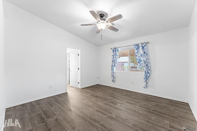 11637 E 27th St, Yuma, AZ 85367 - spare room with dark wood-style flooring, ceiling fan, baseboards, and lofted ceiling