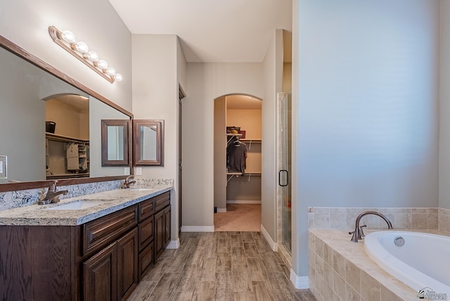 14769 E 47th Ln, Yuma, AZ 85367 - bathroom with a walk in closet, a garden tub, a shower stall, and double vanity