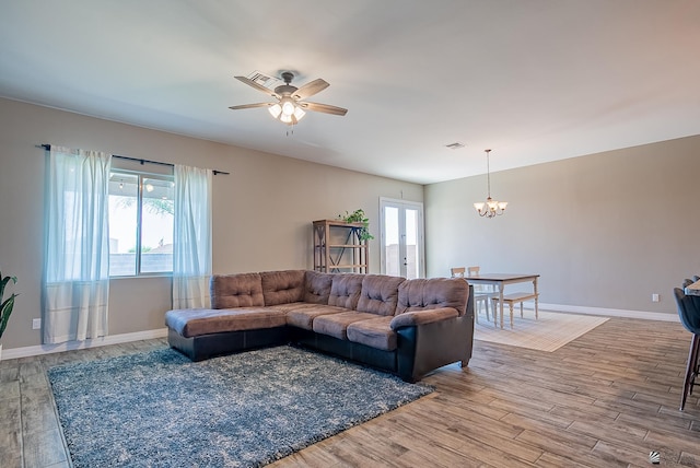 14769 E 47th Ln, Yuma, AZ 85367 - living room with a chandelier, wood finished floors, ceiling fan, and baseboards