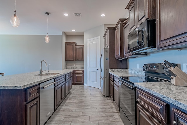 14769 E 47th Ln, Yuma, AZ 85367 - kitchen featuring black appliances, a sink, light countertops, dark brown cabinetry, and recessed lighting