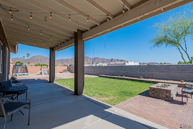 14769 E 47th Ln, Yuma, AZ 85367 - view of patio featuring a mountain view and an outdoor fire pit