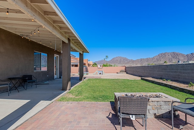 14769 E 47th Ln, Yuma, AZ 85367 - view of patio / terrace featuring a mountain view and a playground