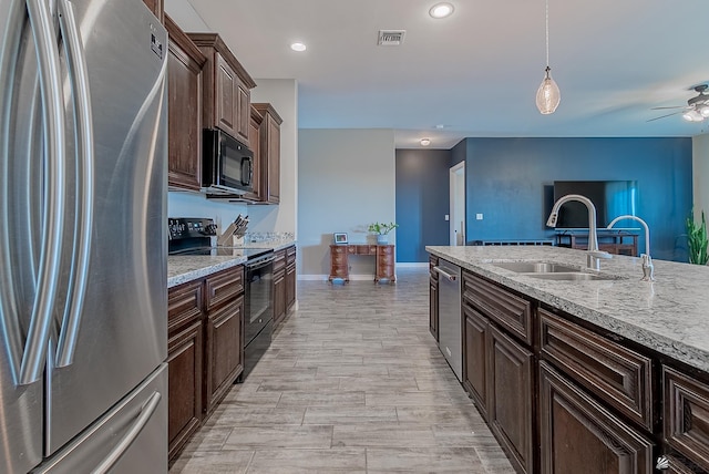 14769 E 47th Ln, Yuma, AZ 85367 - kitchen featuring black appliances, a sink, dark brown cabinets, a ceiling fan, and baseboards