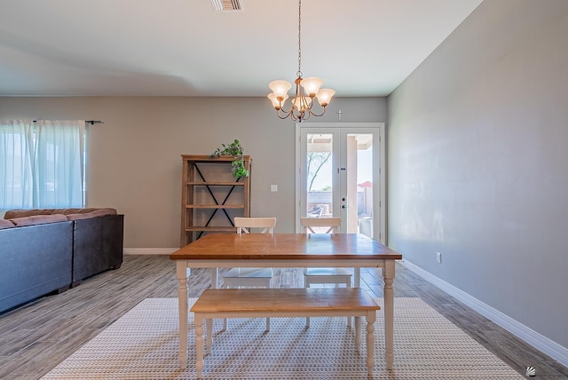 14769 E 47th Ln, Yuma, AZ 85367 - dining area featuring a chandelier, wood finished floors, french doors, and baseboards