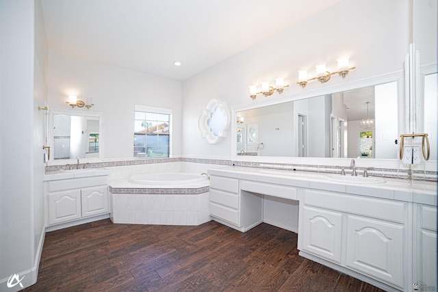 2864 W 12th Ln, Yuma, AZ 85364 - bathroom with wood finished floors, a bath, two vanities, and recessed lighting