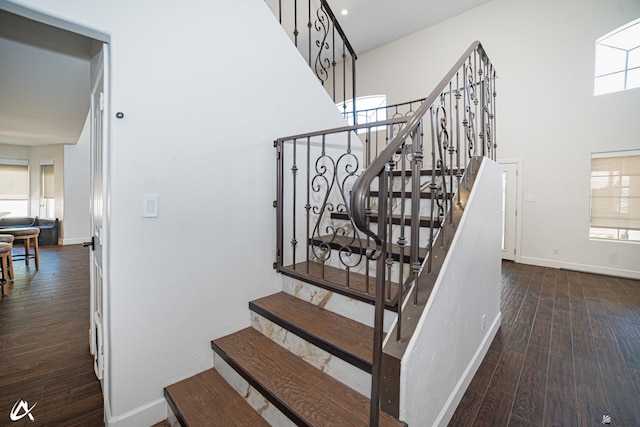 2864 W 12th Ln, Yuma, AZ 85364 - staircase featuring wood finished floors and a high ceiling