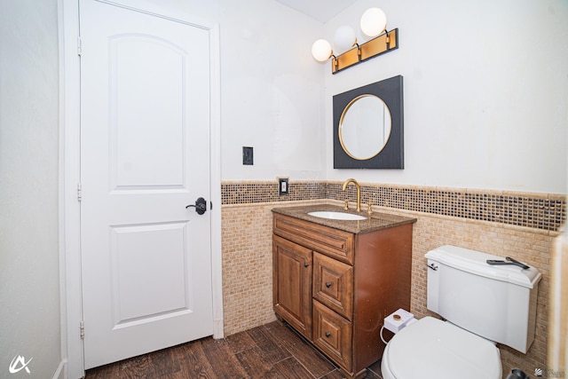 2864 W 12th Ln, Yuma, AZ 85364 - half bathroom with tile walls, vanity, wainscoting, and wood finished floors