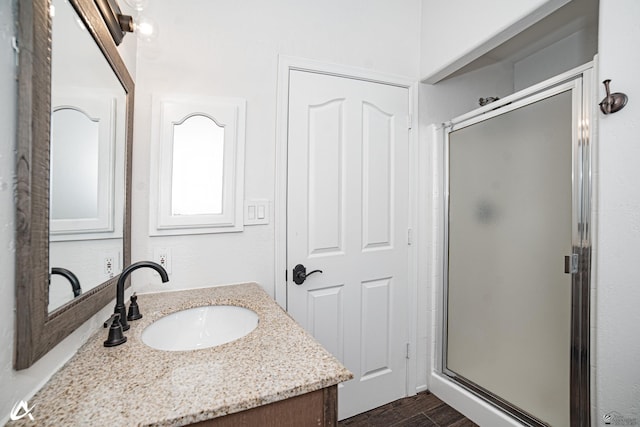 2864 W 12th Ln, Yuma, AZ 85364 - full bath with vanity, a stall shower, and wood finished floors