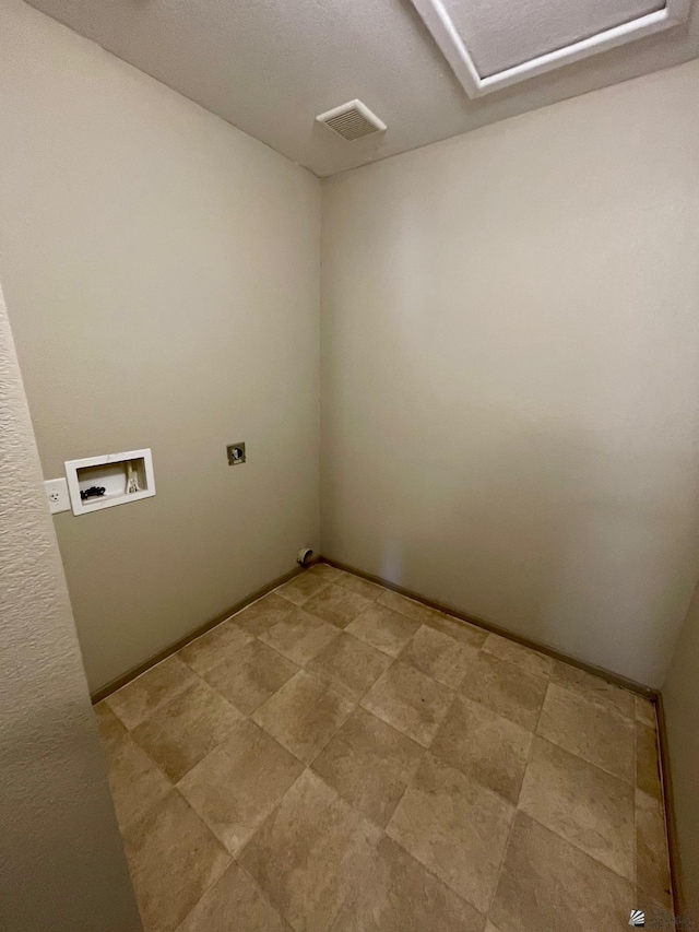 laundry room with hookup for an electric dryer and hookup for a washing machine