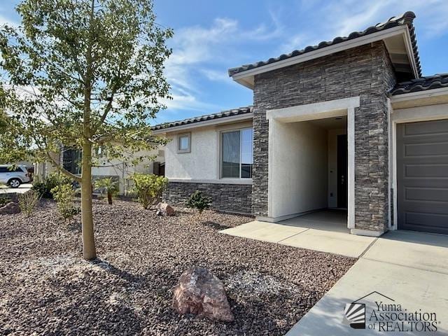 view of property exterior with a garage