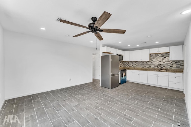1721 S Athens Ave, Yuma, AZ 85364 - kitchen featuring appliances with stainless steel finishes, a sink, backsplash, a ceiling fan, and recessed lighting