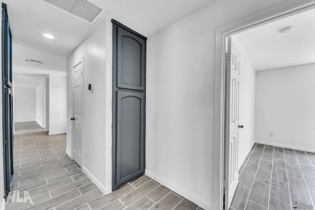 1721 S Athens Ave, Yuma, AZ 85364 - hall featuring baseboards, wood finish floors, and recessed lighting