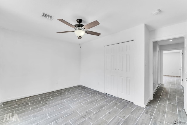 1721 S Athens Ave, Yuma, AZ 85364 - unfurnished bedroom with a closet, wood finished floors, baseboards, and ceiling fan