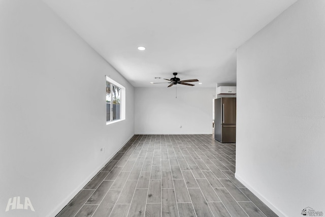 1721 S Athens Ave, Yuma, AZ 85364 - unfurnished room with ceiling fan, baseboards, wood finished floors, and recessed lighting