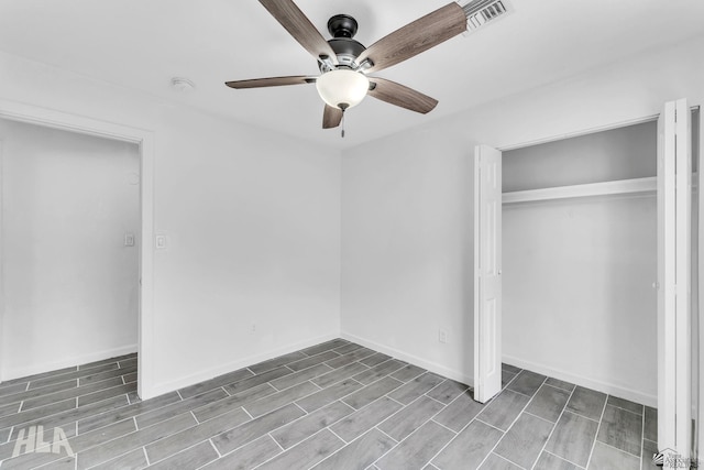 1721 S Athens Ave, Yuma, AZ 85364 - unfurnished bedroom featuring wood finish floors, a closet, ceiling fan, and baseboards