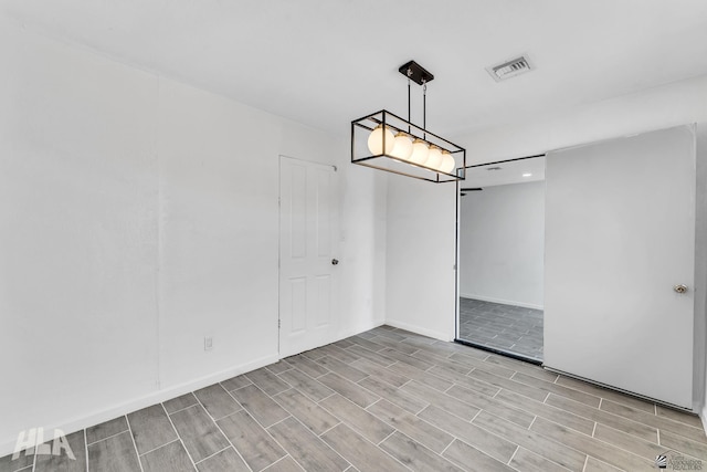 1721 S Athens Ave, Yuma, AZ 85364 - spare room with wood tiled floors, baseboards, and recessed lighting