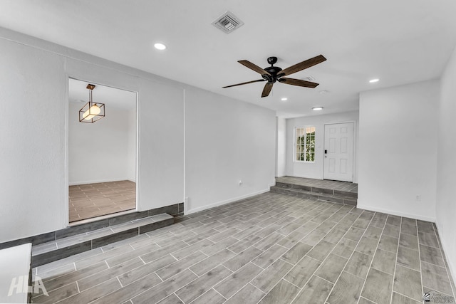 1721 S Athens Ave, Yuma, AZ 85364 - spare room featuring a ceiling fan, recessed lighting, wood finished floors, and baseboards