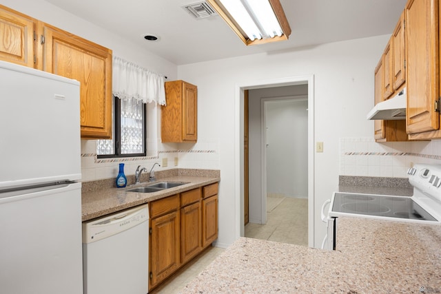 13239 E 47th Dr, Yuma, AZ 85367 - kitchen featuring white appliances, under cabinet range hood, decorative backsplash, and light countertops