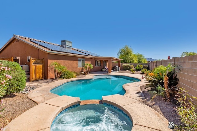 11861 E Eclipse Ct, Yuma, AZ 85367 - view of swimming pool with a patio, a pool with connected hot tub, and a fenced backyard
